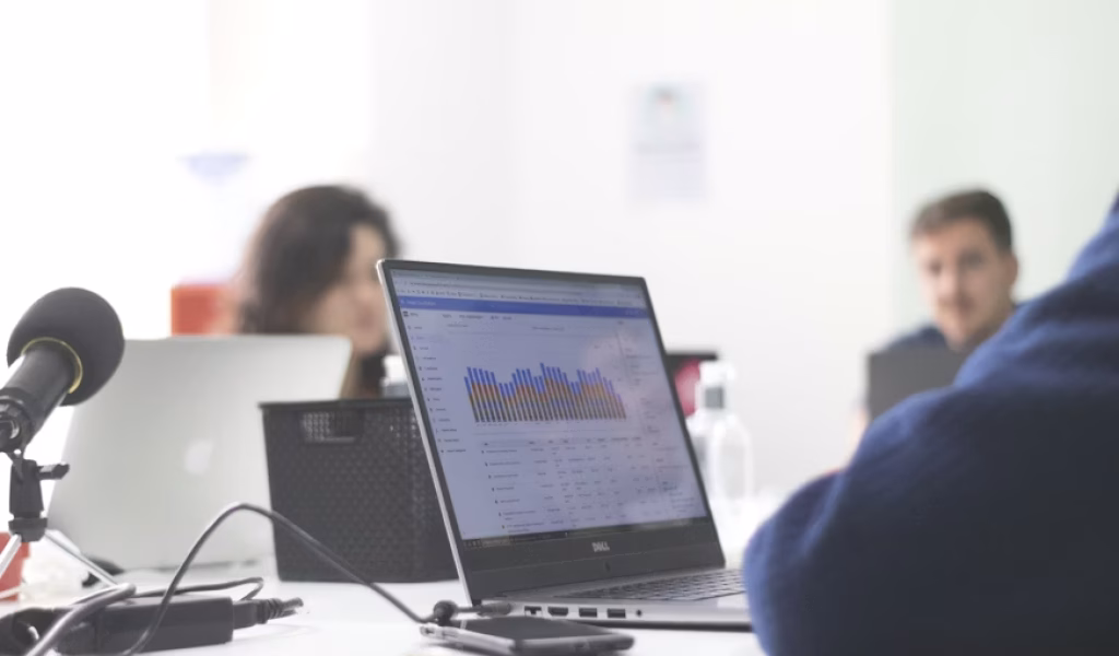 Local SEO analytics dashboard displayed on laptop during team meeting