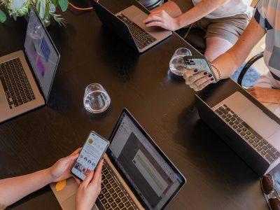Off page SEO teamwork with laptops and mobile devices for link building and outreach